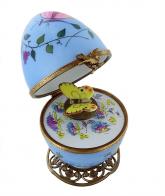 Oeufs musicaux de style Fabergé fabriqués en France Oeuf musical de style Fabergé en porcelaine de Limoges avec papillon jaune - Roméo et Juliette (Nino Rota)