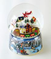 Boules à neige musicales de Noël disponibles sur commande (nous contacter) Boule à neige musicale animée de Noël avec globe en verre, avion du Père Noël et train passant sous une montagne