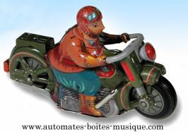 Jouets mécaniques en métal, tôle et fer blanc Jouet mécanique en métal, tôle et fer blanc : jouet mécanique personnage sur moto