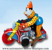 Jouets mécaniques en métal, tôle ou fer blanc Jouet mécanique en métal, tôle et fer blanc : jouet mécanique clown sur moto