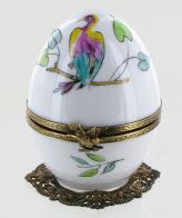 Oeufs musicaux de style Fabergé fabriqués en France Oeuf musical de style Fabergé : oeuf musical blanc en porcelaine de Limoges avec oiseau