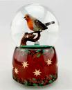 Boule à neige musicale de Noël avec globe en verre et rouge-gorge perché sur une branche