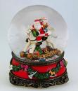 Boule à neige musicale de Noël avec globe en verre et Père Noël et enfant sur un cheval à bascule