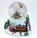 Boule à neige musicale animée de Noël avec globe en verre et traneau du Père Noël volant au-dessus d'un village