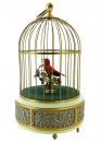 Automate oiseau chanteur mécanique dans une cage dorée avec base en métal décorée de putti