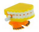 Petit automate m&eacute;canique en r&eacute;sine avec m&eacute;canisme &agrave; ressort - Dentier m&eacute;canique jaune