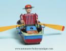Jouet mécanique en métal, tôle et fer blanc : jouet mécanique bateau avec personnage avec chapeau